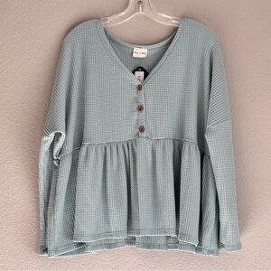 Lovely Melody women’s mint long sleeve v-neck with button detail shirt, size L.
